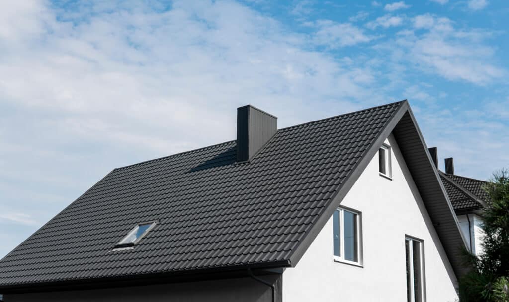 Modern roof covered with tile effect PVC coated brown metal roof sheets