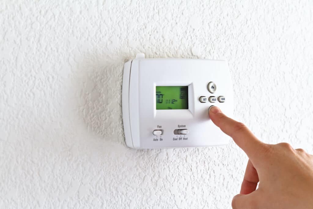 digital thermostat with finger